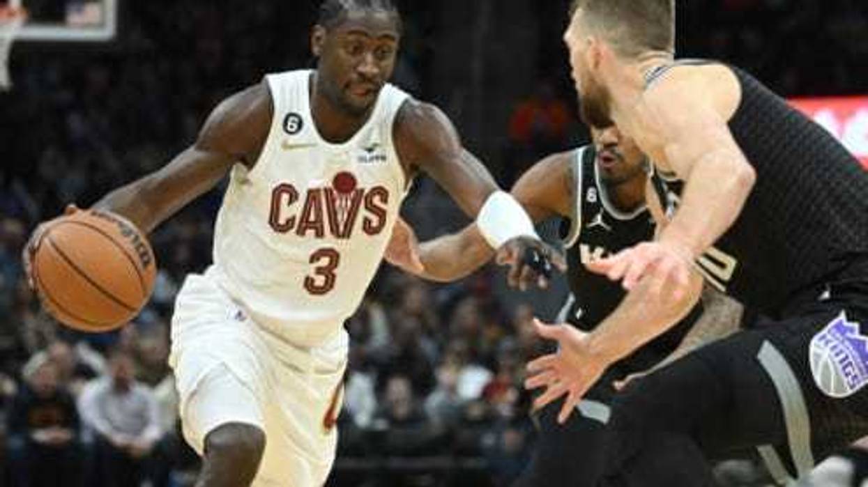 Cleveland Cavaliers guard Caris LeVert (3) drives to the basket against Sacramento Kings forward Domantas Sabonis (10) and guard Malik Monk (0) during the second half at Rocket Mortgage FieldHouse.