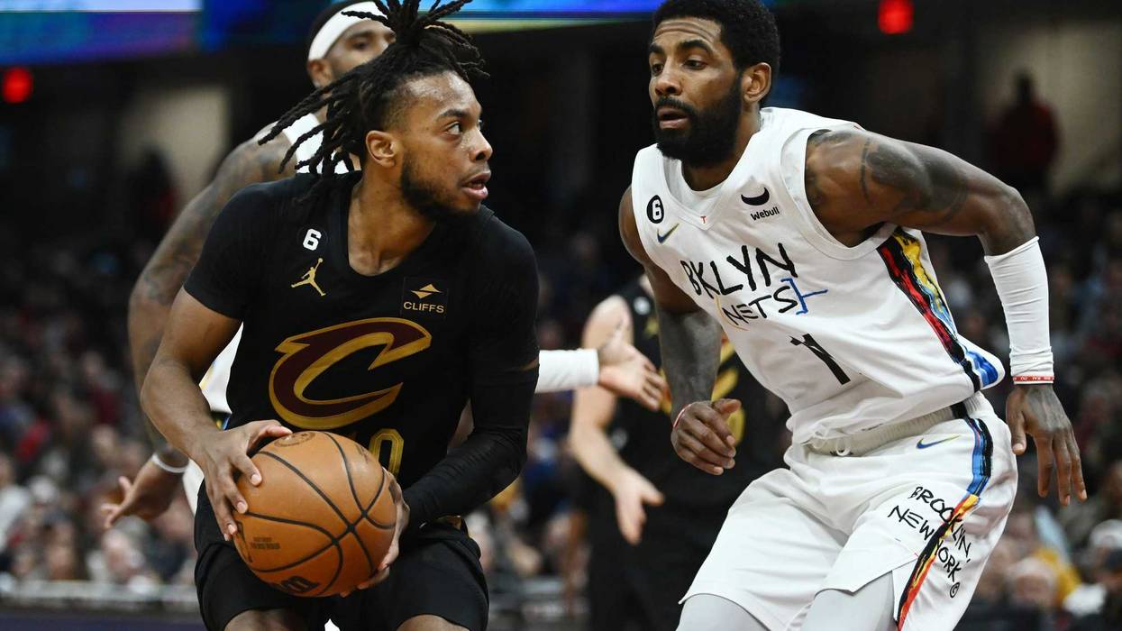 Cleveland Cavaliers guard Darius Garland (10) drives to the basket against Brooklyn Nets guard Kyrie Irving (11)