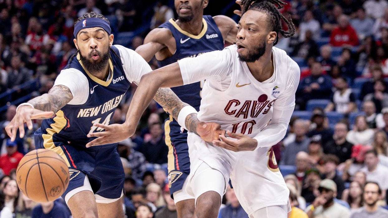 Cleveland Cavaliers guard Darius Garland (10) looks to pass the ball against New Orleans Pelicans forward Brandon Ingram (14) during the first half at Smoothie King Center.