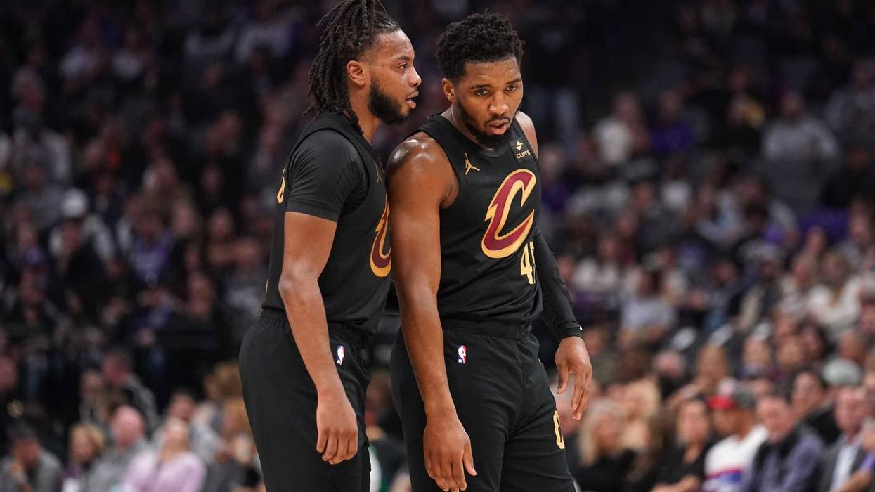 Cleveland Cavaliers guard Darius Garland (10) talks with guard Donovan Mitchell (45).
