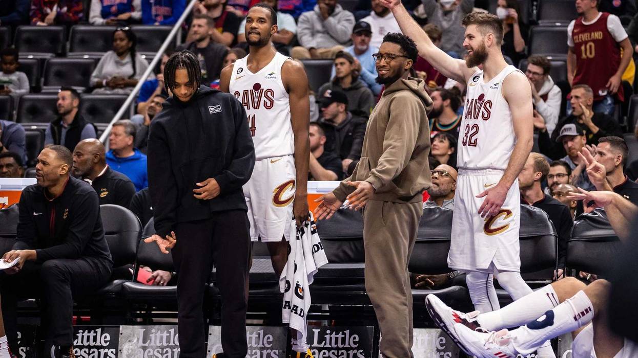 Cleveland Cavaliers guard Darius Garland (left), forward Evan Mobley (4), guard Donovan Mitchell (center right) and forward Dean Wade (32) cheer on their team during a game this season.