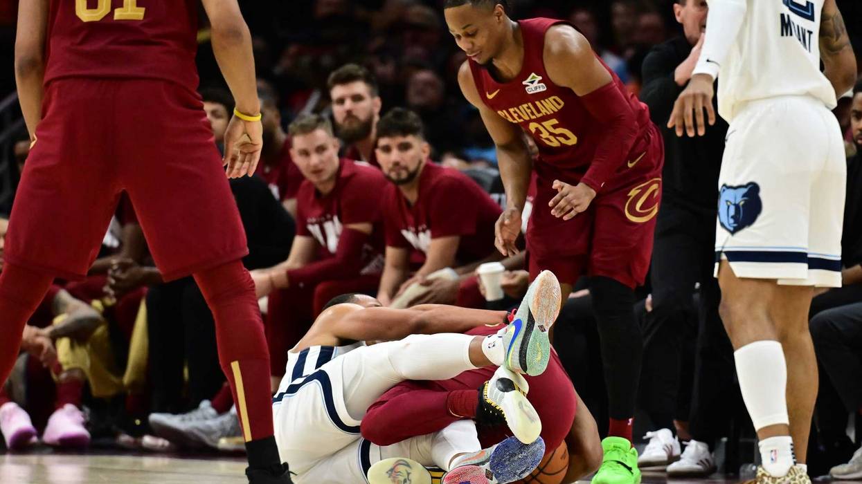 Cleveland Cavaliers guard Donovan Mitchell (45) and Memphis Grizzlies guard Desmond Bane (22) fight for the ball during the second half at Rocket Arena.