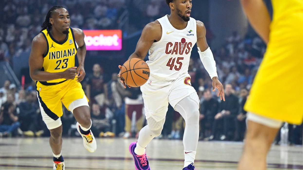 Cleveland Cavaliers guard Donovan Mitchell (45) brings the ball up court beside Indiana Pacers forward Aaron Nesmith (23) in the first quarter during game two of the second round of the 2025 NBA Playoffs at Rocket Arena