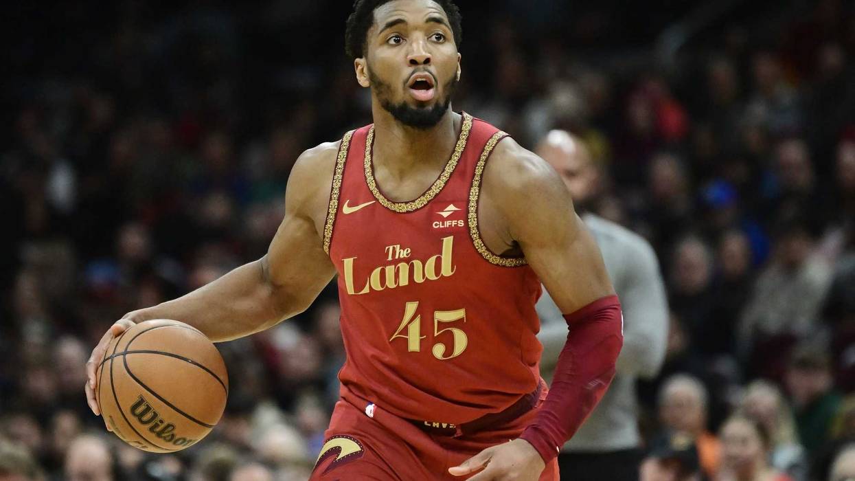 Cleveland Cavaliers guard Donovan Mitchell (45) brings the ball up court during the second half against the Philadelphia 76ers at Rocket Mortgage FieldHouse.