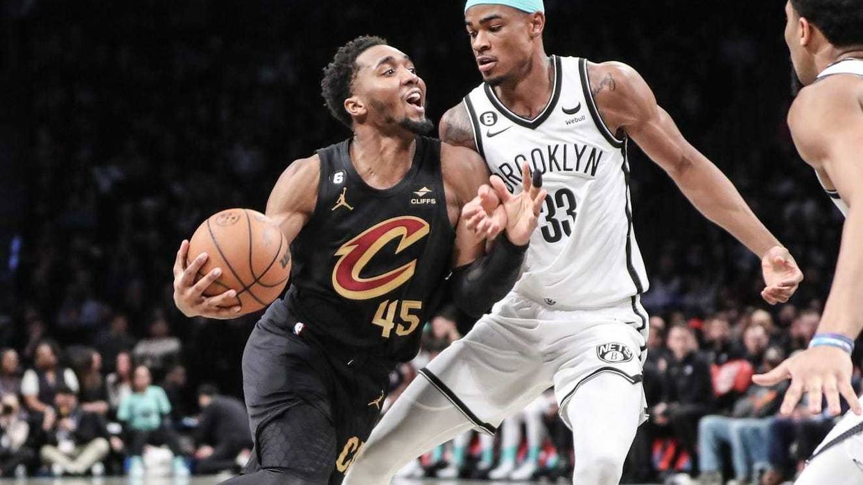 Cleveland Cavaliers guard Donovan Mitchell (45) looks to drive past Brooklyn Nets center Nic Claxton (33) in the second quarter at Barclays Center.