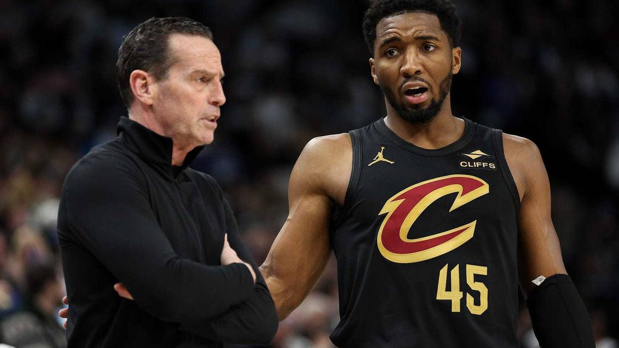 Cleveland Cavaliers guard Donovan Mitchell (45) talks with head coach Kenny Atkinson