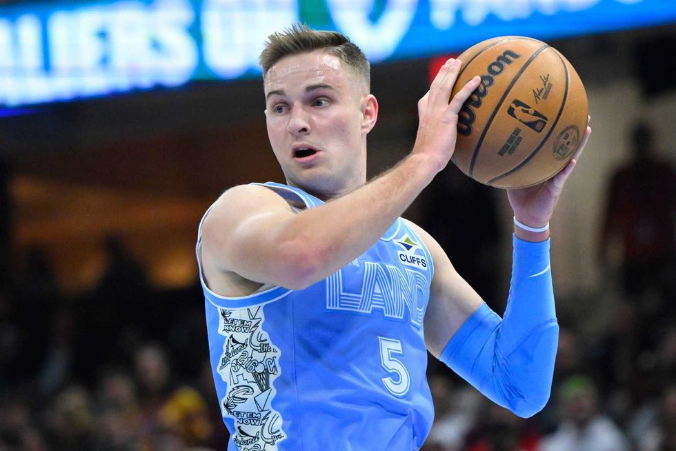 Cleveland Cavaliers guard Sam Merrill (5) rebounds in the first quarter against the Utah Jazz at Rocket Mortgage FieldHouse.