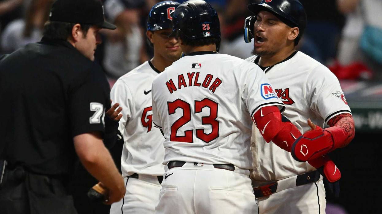 Cleveland Guardians catcher Bo Naylor (23) celebrates with first baseman Josh Naylor (22) and second baseman Tyler Freeman (2) after hitting a three-run home run during the seventh inning against the Baltimore Orioles at Progressive Field.
