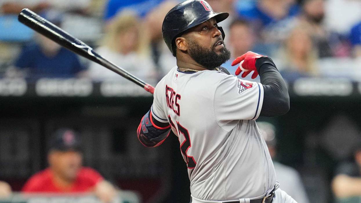 Cleveland Guardians designated hitter Franmil Reyes (32) hits a home run against the Kansas City Royals during the seventh inning at Kauffman Stadium.