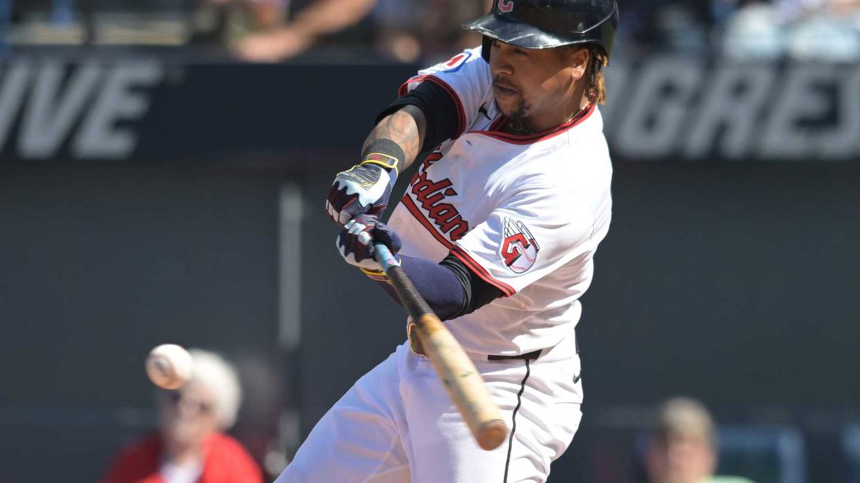 Cleveland Guardians designated hitter Jose Ramirez (11) hits a single against the Chicago White Sox during the fourth inning at Progressive Field.