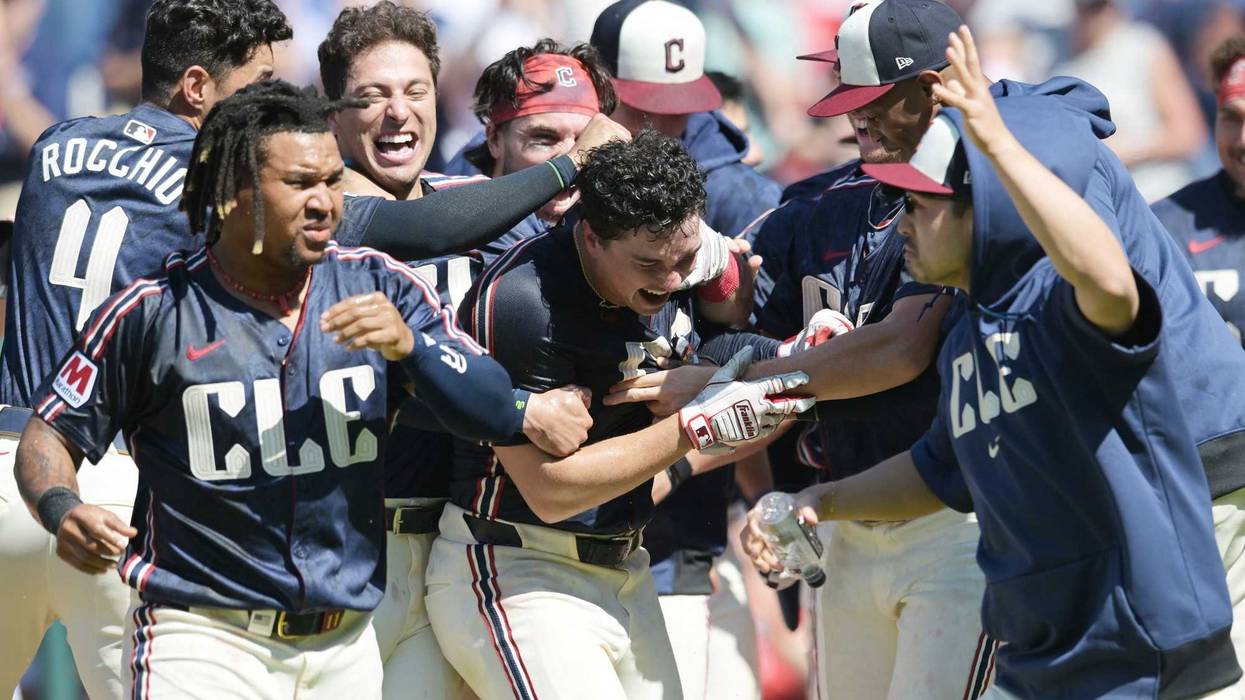Cleveland Guardians left fielder Will Brennan, middle celebrates with teammates after hitting a walk off three run home run during the ninth inning against the Minnesota Twins at Progressive Field.