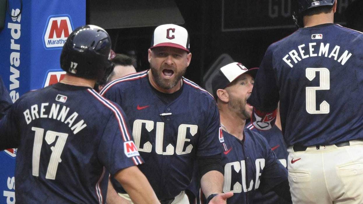 Cleveland Guardians manager Stephen Vogt (12) celebrates in the seventh inning against the Kansas City Royals at Progressive Field.