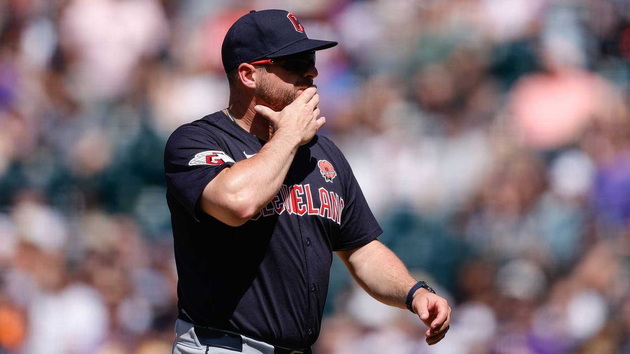 Cleveland Guardians manager Stephen Vogt (12) walks to the dugout after making a pitching change in the fourth inning against the Colorado Rockies at Coors Field.