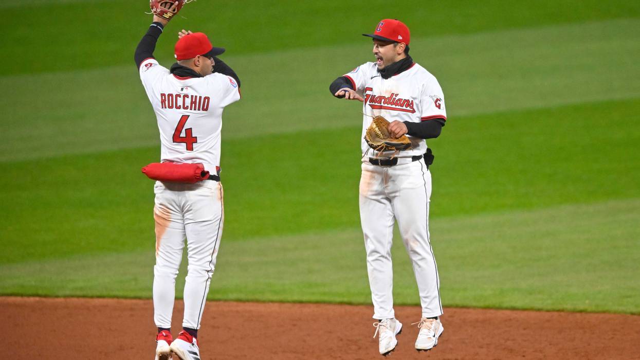 Cleveland Guardians shortstop Brayan Rocchio (4) and left fielder Steven Kwan (38) celebrate a win over the Kansas City Royals at Progressive Field.