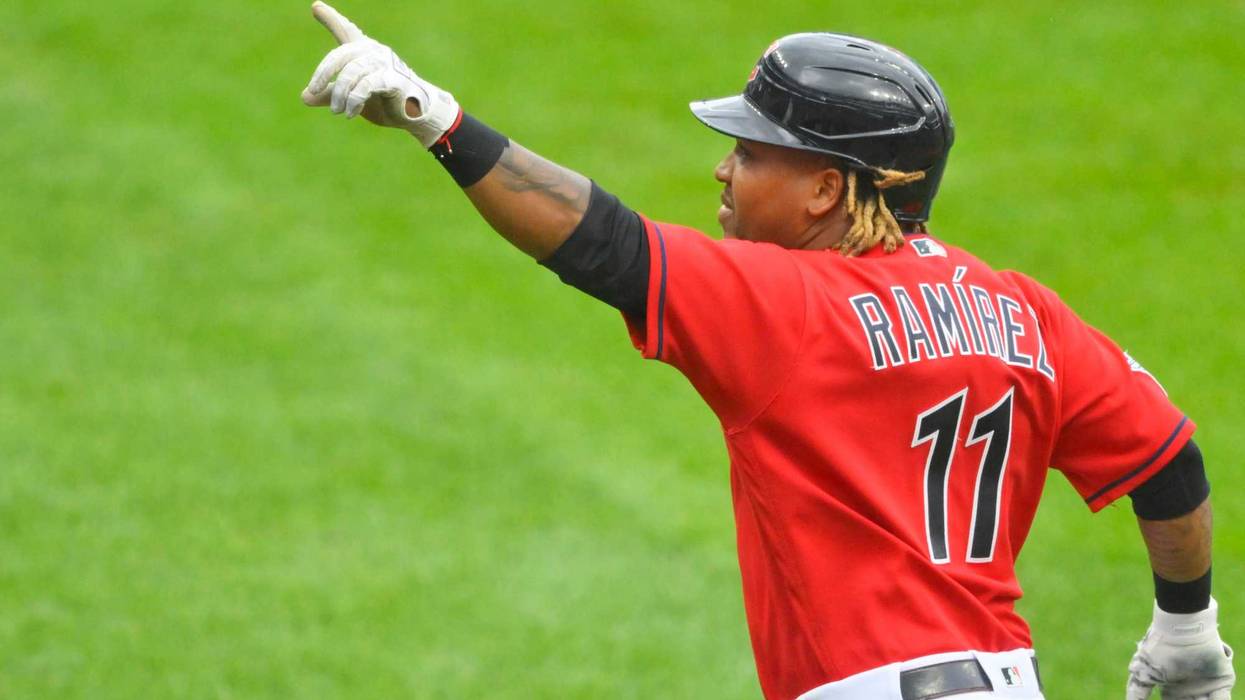 Cleveland Guardians third baseman Jose Ramirez (11) celebrates his three-run home run in the first inning against the Detroit Tigers at Progressive Field.