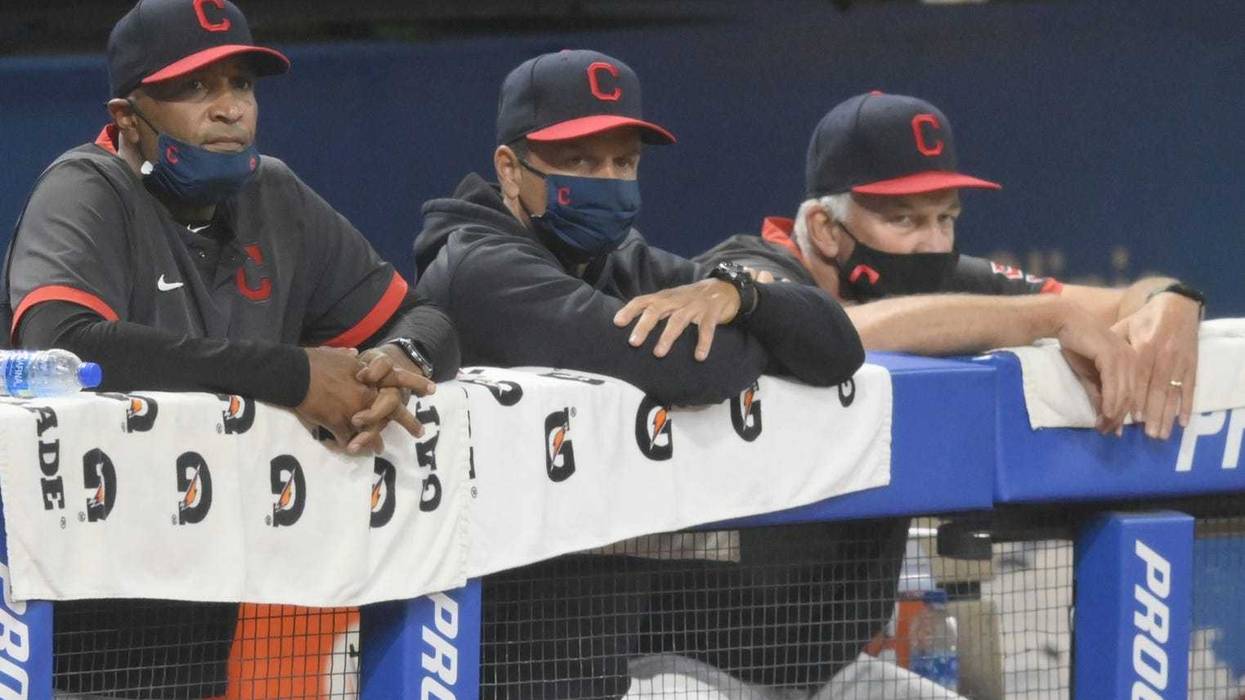 Cleveland Indians acting manager Sandy Alomar Jr, left, bench coach Mike Sarbaugh, center, and pitching coach Carl Willis watch from the dugout in the eighth inning against the Kansas City Royals at Progressive Field.
