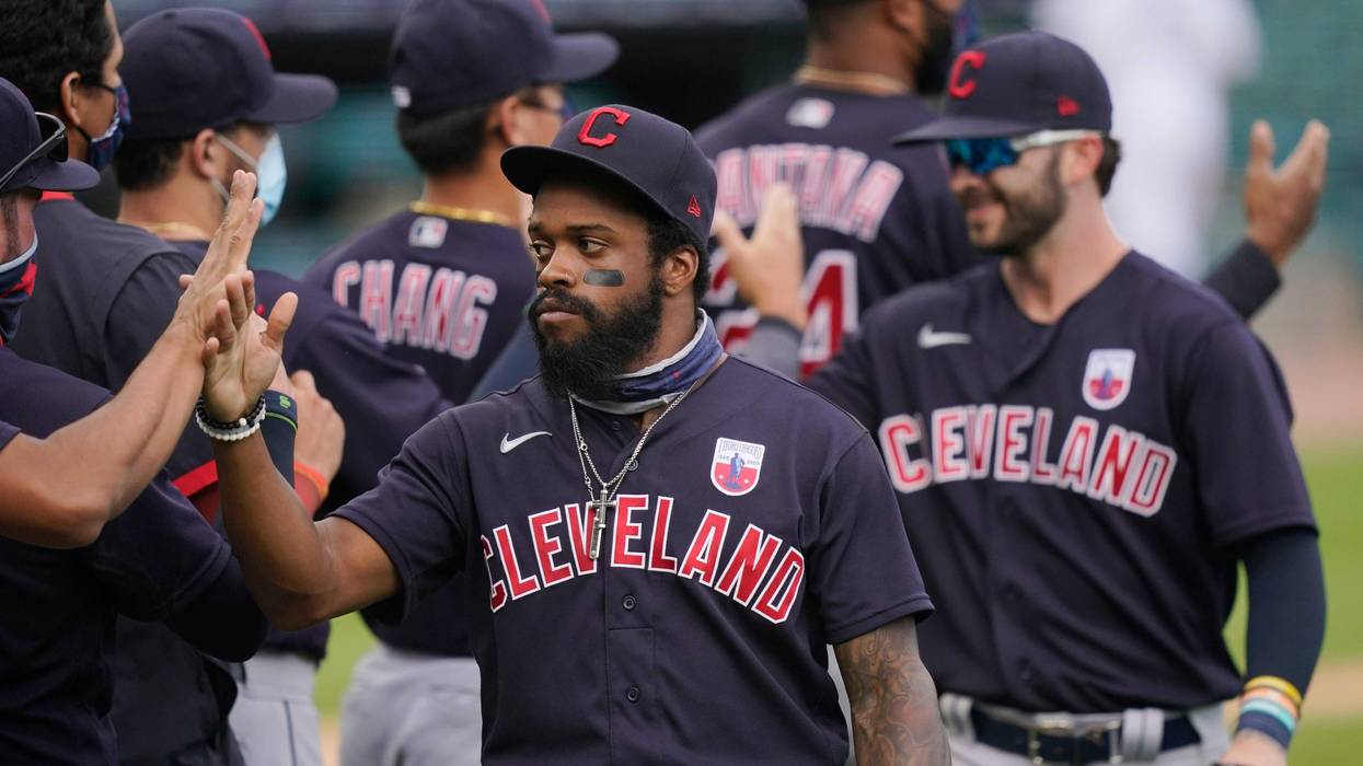 Cleveland Indians center fielder Delino DeShields greets teammates after their 8-5 over the Detroit Tigers in a baseball game, Sunday, Aug. 16, 2020, in Detroit