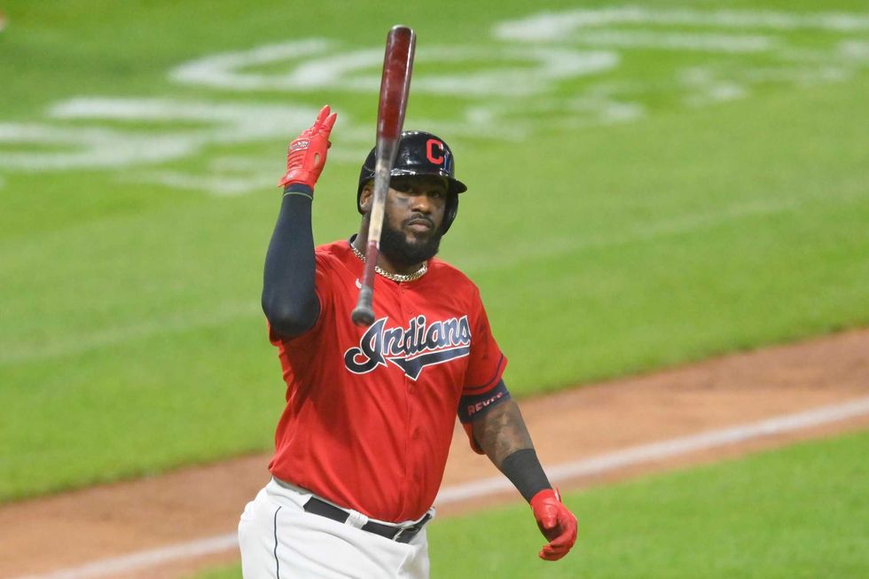 Cleveland Indians designated hitter Franmil Reyes (32) tosses his bat after hitting a game-winning three-run home run in the ninth inning against the Kansas City Royals at Progressive Field