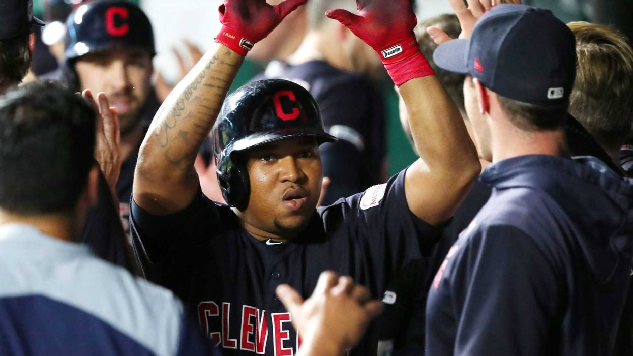 Cleveland Indians designated hitter Jose Ramirez (11) is congratulated after hitting a home run against the Kansas City Royals during the sixth inning at Kauffman Stadium.