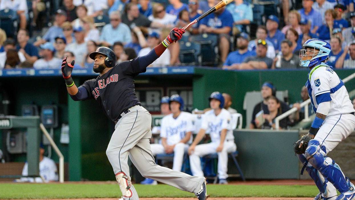Cleveland Indians first baseman Carlos Santana (41) follows through on a swing for a home run in the fourth inning against the Kansas City Royals at Kauffman Stadium.