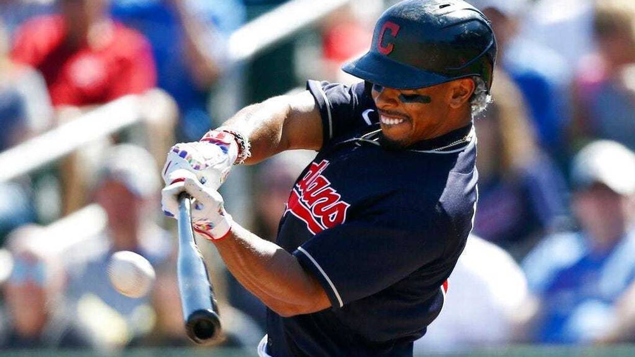 Cleveland Indians' Francisco Lindor connects for a home run against the Chicago Cubs during the first inning of a spring training baseball game Saturday, March 7, 2020, in Goodyear, Ariz.