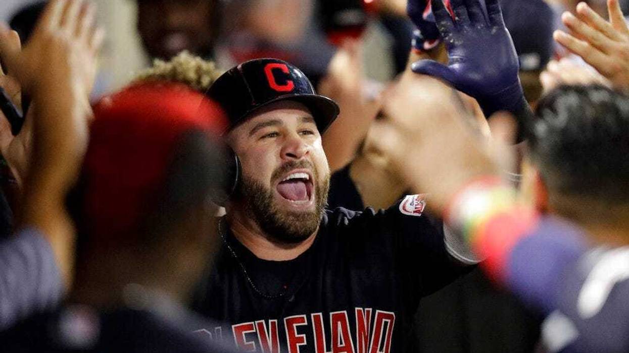 Cleveland Indians' Jason Kipnis celebrates in the dugout after a two-run home run against the Los Angeles Angels during the second inning of a baseball game in Anaheim, Calif., Monday, Sept. 9, 2019. (