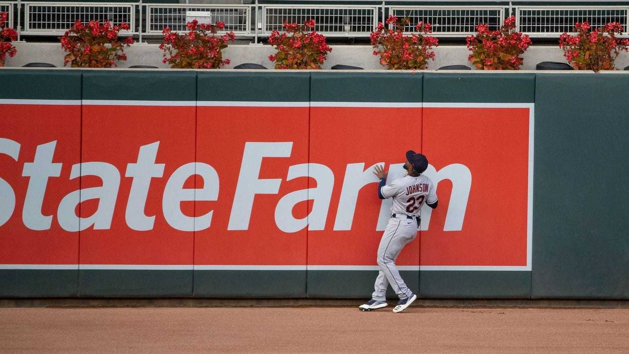 Cleveland Indians left fielder Daniel Johnson (23) looks on at Minnesota Twins left fielder Eddie Rosario (20) (not picutred) solo home run during the fourth inning at Target Field