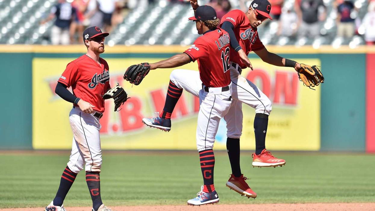 Cleveland Indians left fielder Jordan Luplow celebrates with shortstop Francisco Lindor and center fielder Oscar Mercado