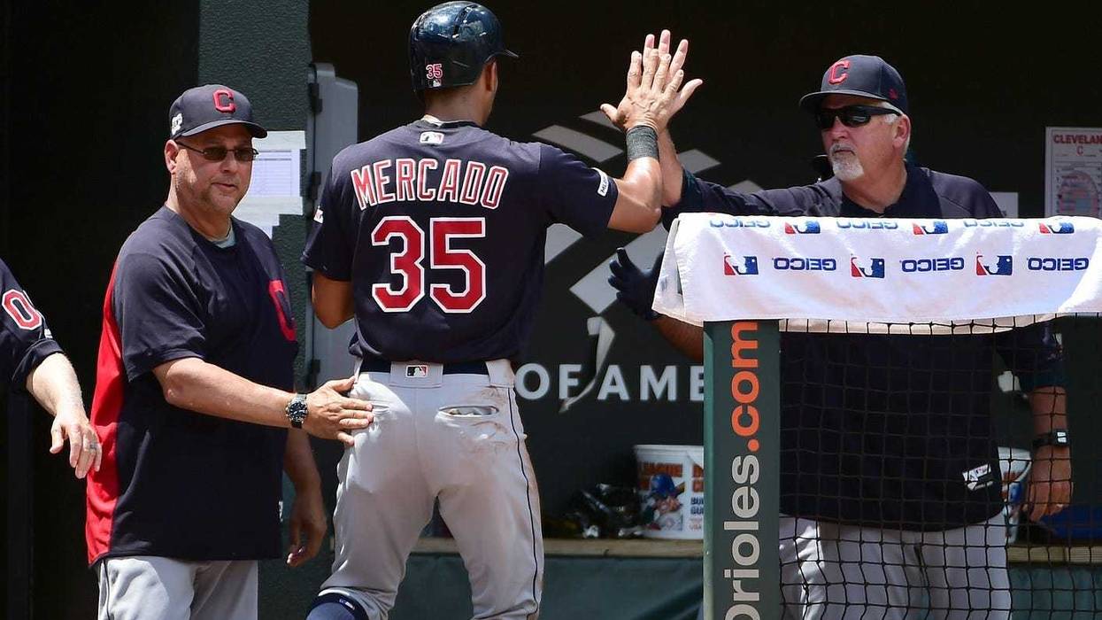Cleveland Indians manager Terry Francona (left) congratulates outfielder Oscar Mercado (35) after scoring a run in the third inning against the Baltimore Orioles at Oriole Park at Camden Yards.