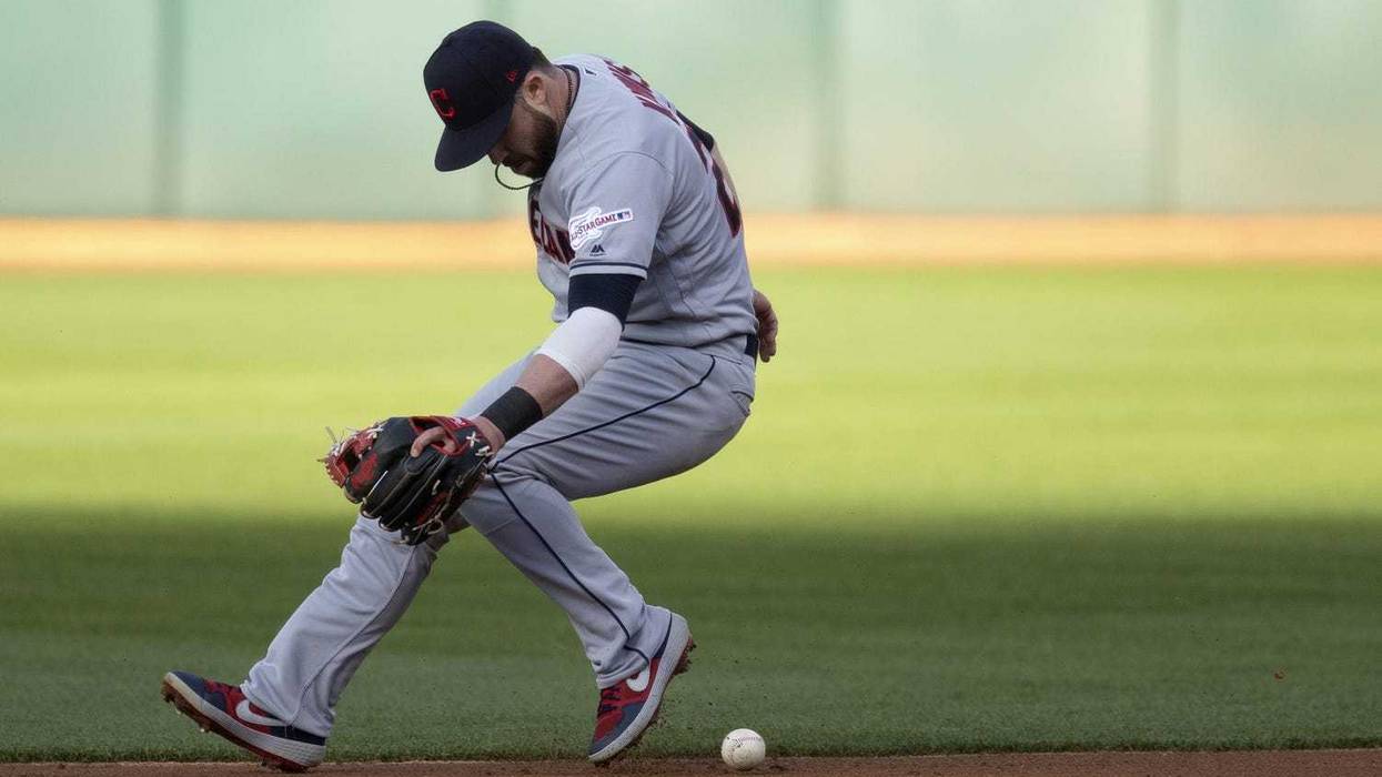 Cleveland Indians second baseman Jason Kipnis (22) fields a ball hit by Oakland Athletics Jurickson Profar during the first inning of a Major League Baseball game at Oakland Coliseum.