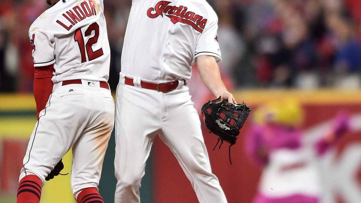 Cleveland Indians shortstop Francisco Lindor (12) and right fielder Jay Bruce (32) celebrates after beating the New York Yankees in game one of the 2017 ALDS at Progressive Field.