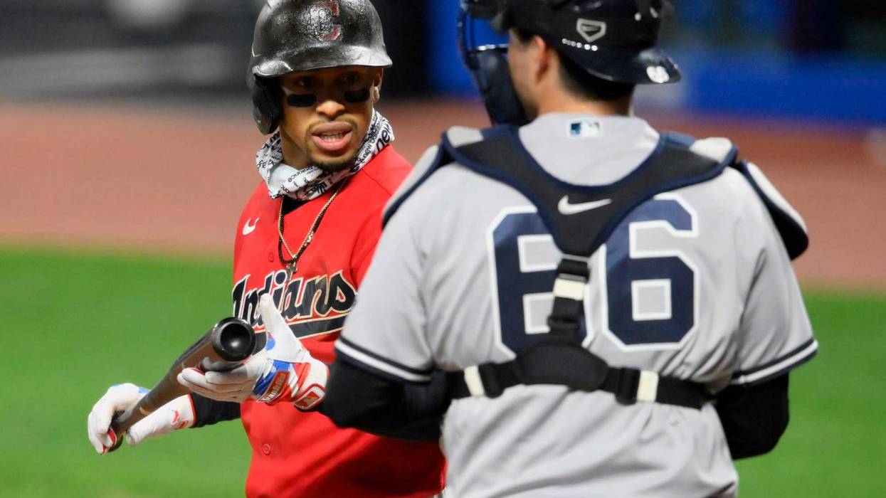 Cleveland Indians shortstop Francisco Lindor (left) reacts after striking out as New York Yankees catcher Kyle Higashioka (66) looks on in the eighth inning at Progressive Field.