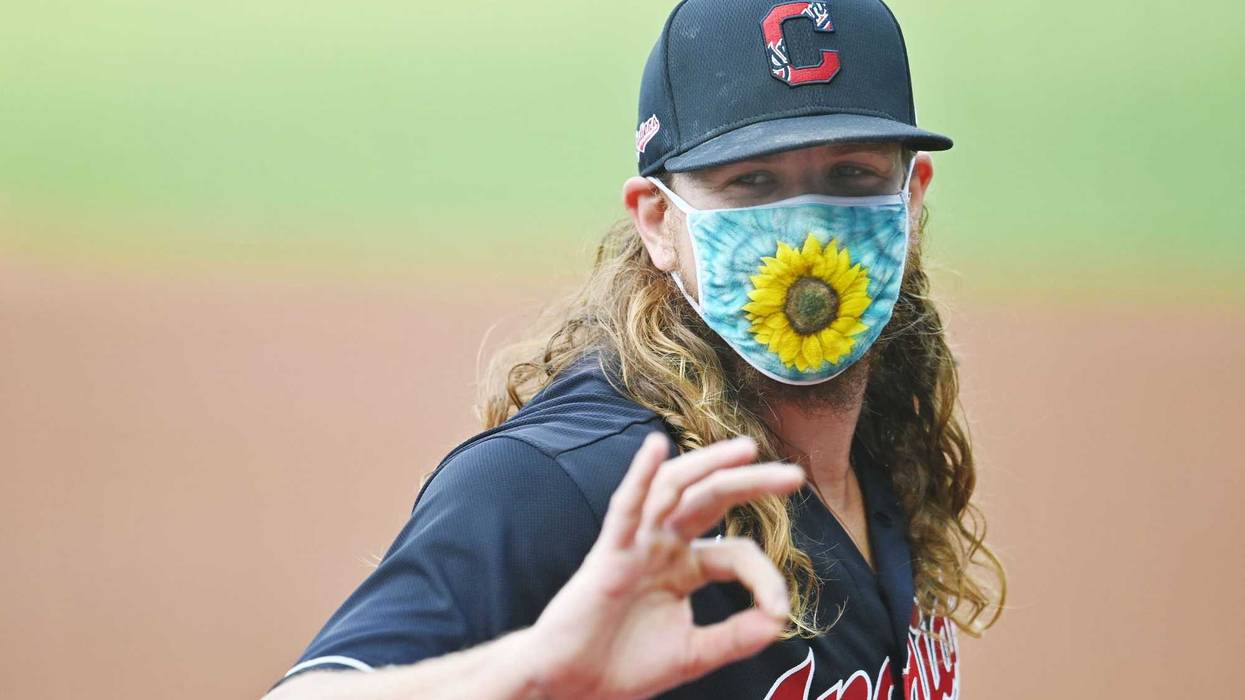 Cleveland Indians starting pitcher Mike Clevinger (52) flashes the OK sign at teammates before the game between the Cleveland Indians and the Pittsburgh Pirates at Progressive Field.