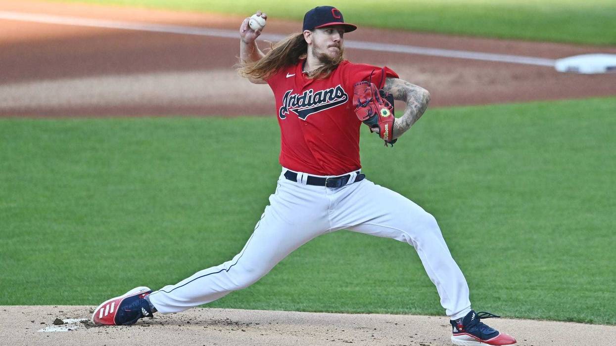 Cleveland Indians starting pitcher Mike Clevinger (52) throws a pitch during the first inning against the Cincinnati Reds at Progressive Field.