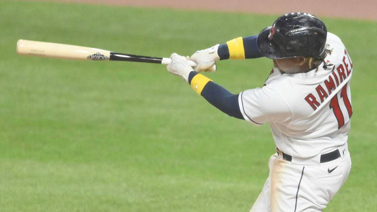 Cleveland Indians third baseman Jose Ramirez (11) hits a two run home run in the fifth inning against the Milwaukee Brewers at Progressive Field.