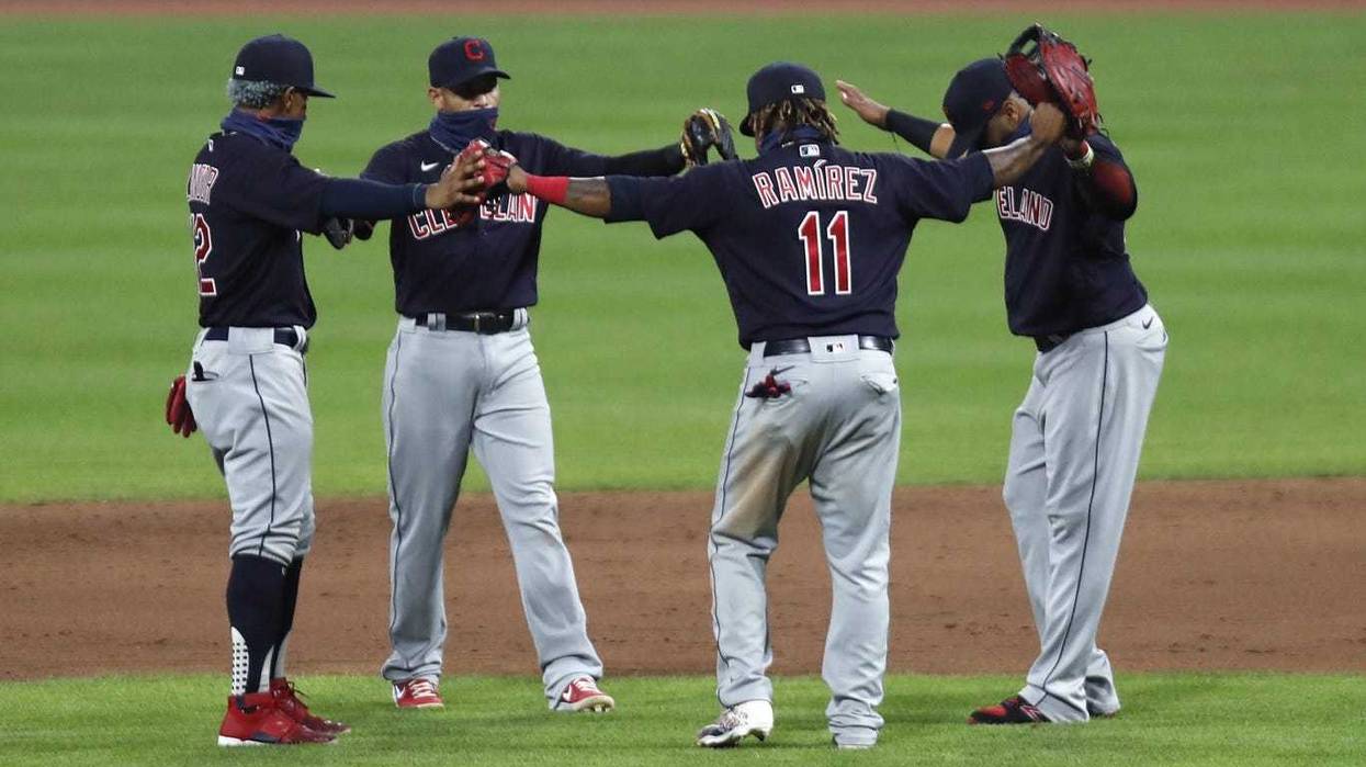 Cleveland Indians third baseman Jose Ramirez (11) reacts with teammates after the Indians defeated the Cincinnati Reds at Great American Ball Park.