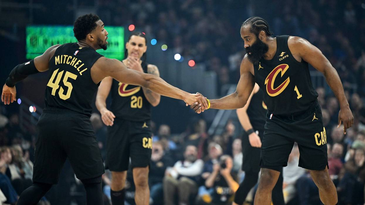 CLEVELAND, OHIO - FEBRUARY 11: Donovan Mitchell #45 and James Harden #1 of the Cleveland Cavaliers celebrate during the first half against the Washington Wizards at Rocket Arena on February 11, 2026 in Cleveland, Ohio.