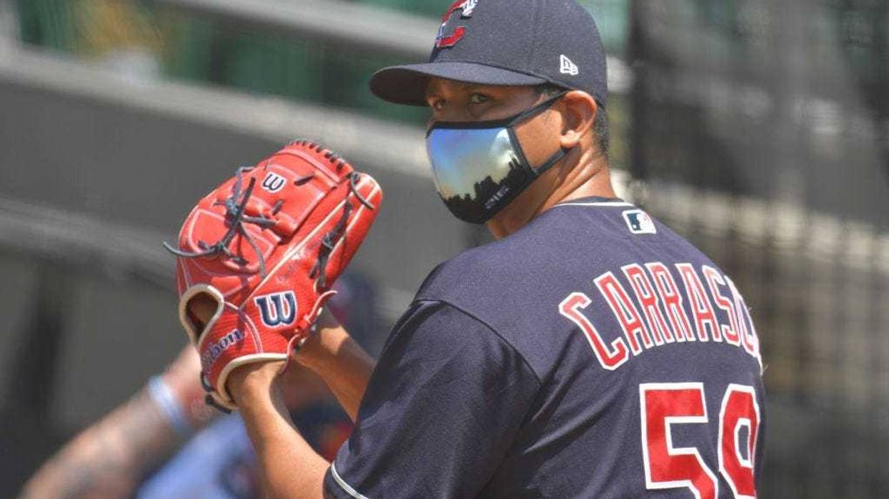 CLEVELAND, OHIO - JULY 06: Pitcher Carlos Carrasco #59 of the Cleveland Indians throws in the bullpen during summer workouts at Progressive Field on July 06, 2020 in Cleveland, Ohio. (Photo by Jason Miller/Getty Images)
