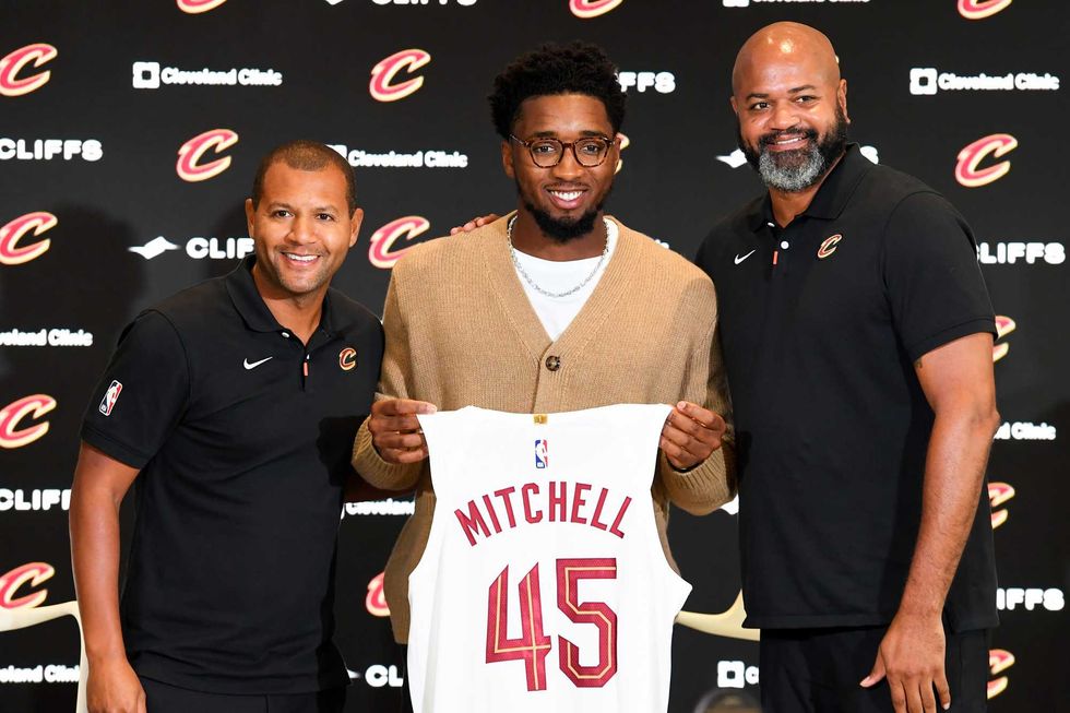 CLEVELAND, OHIO - SEPTEMBER 14: (L to R) Cleveland Cavaliers president of basketball operations Koby Altman, Donovan Mitchell and head coach J. B. Bickerstaff pose for a photo during a press conference where Mitchell was introduced at Rocket Mortgage Fieldhouse on September 14, 2022 in Cleveland, Ohio