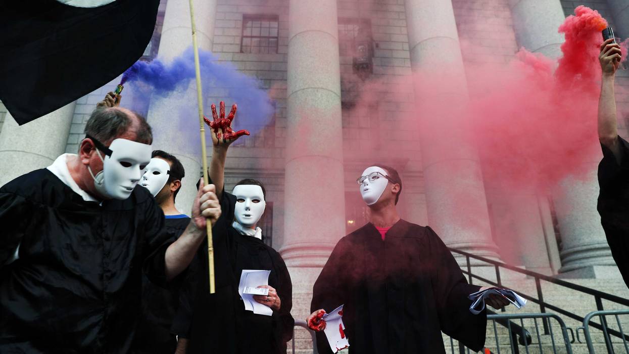 Climate activists, including members of Extinction Rebellion, participate in a demonstration in front of the Thurgood Marshall US Courthouse against a recent Supreme Court ruling on June 30, 2022 in New York City. In a ruling that sent anger through the environmental community, the Supreme Court curbed the Environmental Protection Agency's ability to broadly regulate carbon emissions from existing power plants. The decision will further limit the Biden administration’s authority to restrict the carbon pollution that is contributing to global warming.