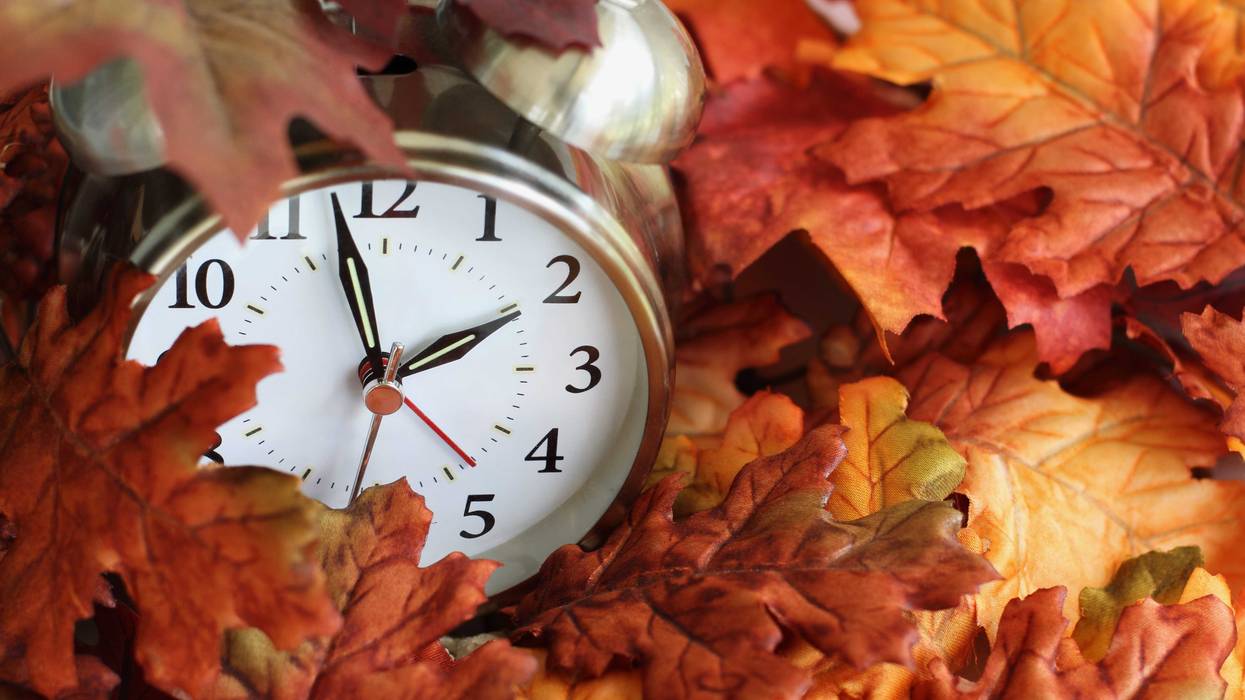 clock in fall leaves