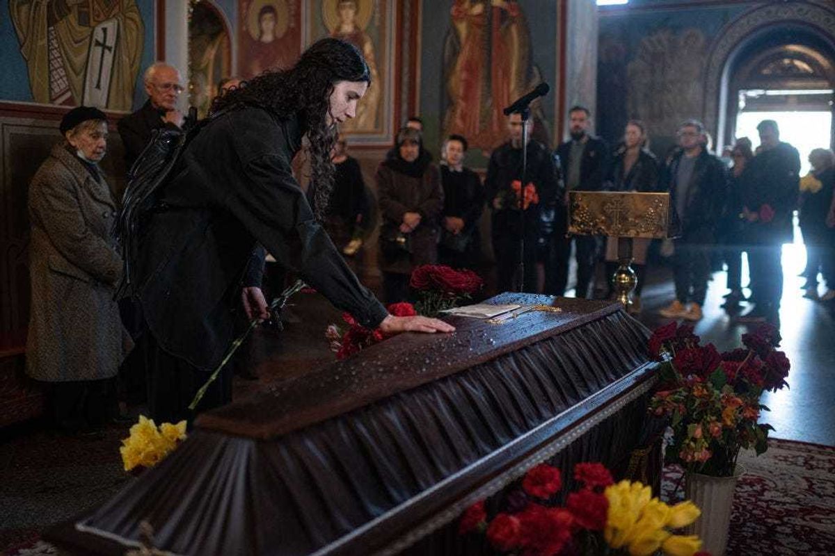 Close relatives and friends of Vira Hyrych pay their respects during the funeral service in St. Michaels Cathedral on May 3, 2022 in Kyiv, Ukraine. Ms Hyrych, a journalist who worked for Radio Free Europe/Radio Liberty, died last Thursday when Russian missiles hit her apartment building in the city's Shevchenkivskyi district. (Photo by Alexey Furman/Getty Images)