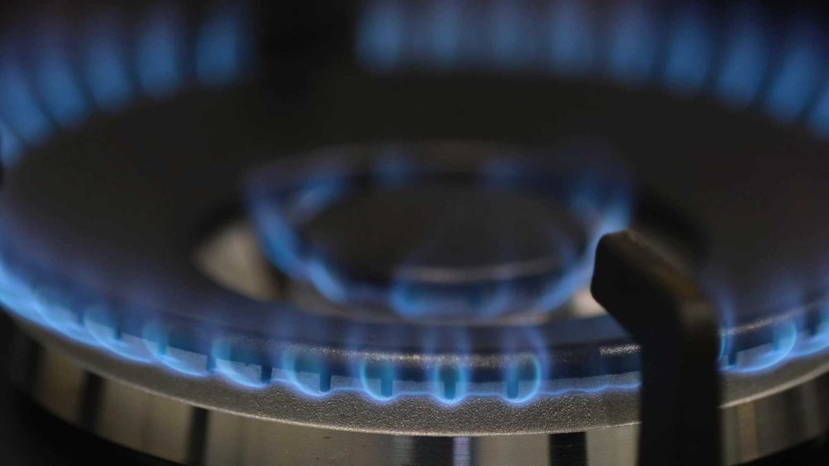 Close-up of a burning gas burner in a dark room. Use of natural gas. 4k video