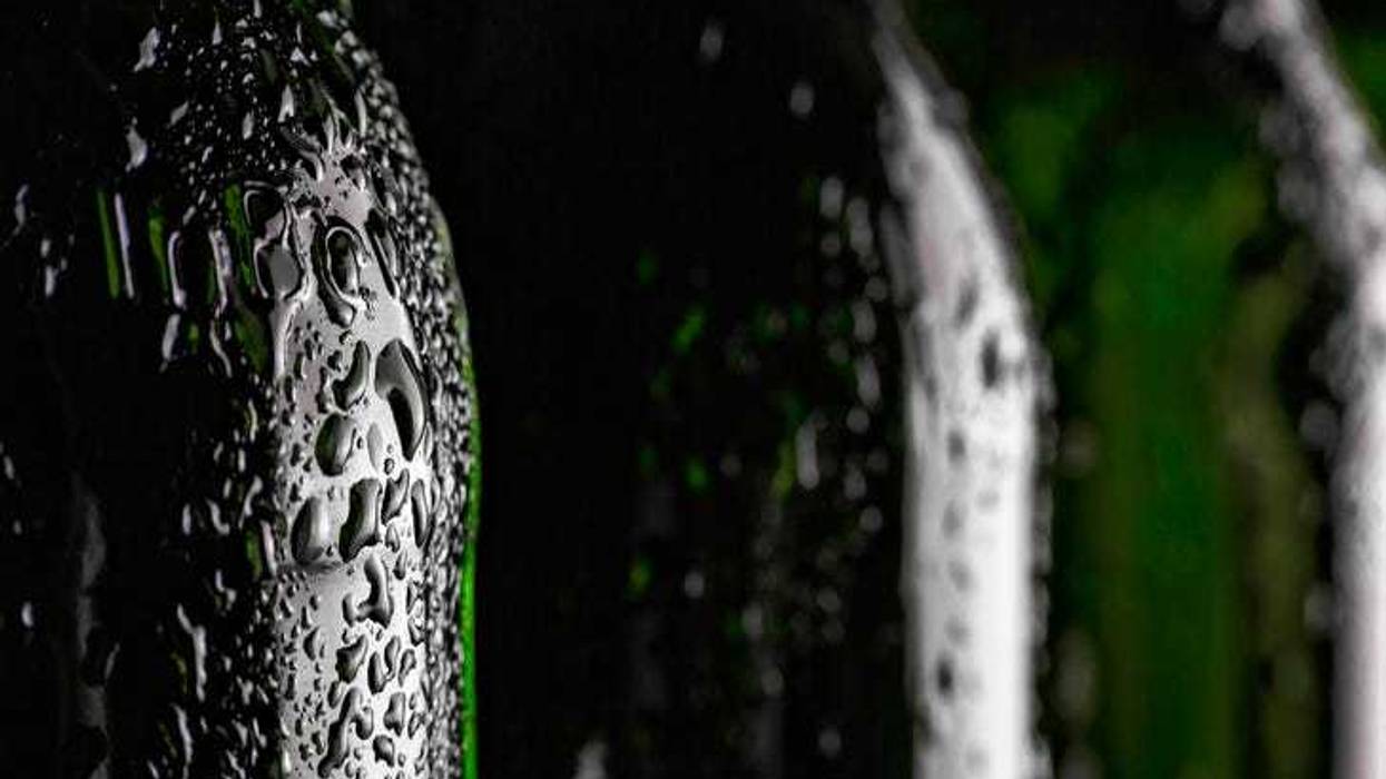 Close up of a soda bottle in hot weather.