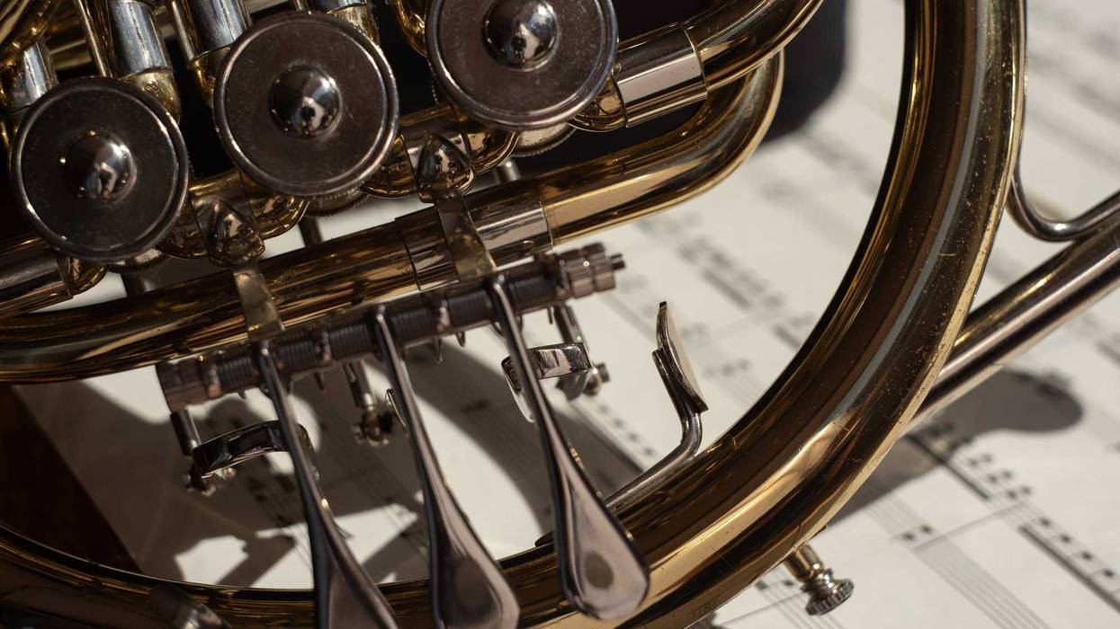 Close up of an instrument and music.