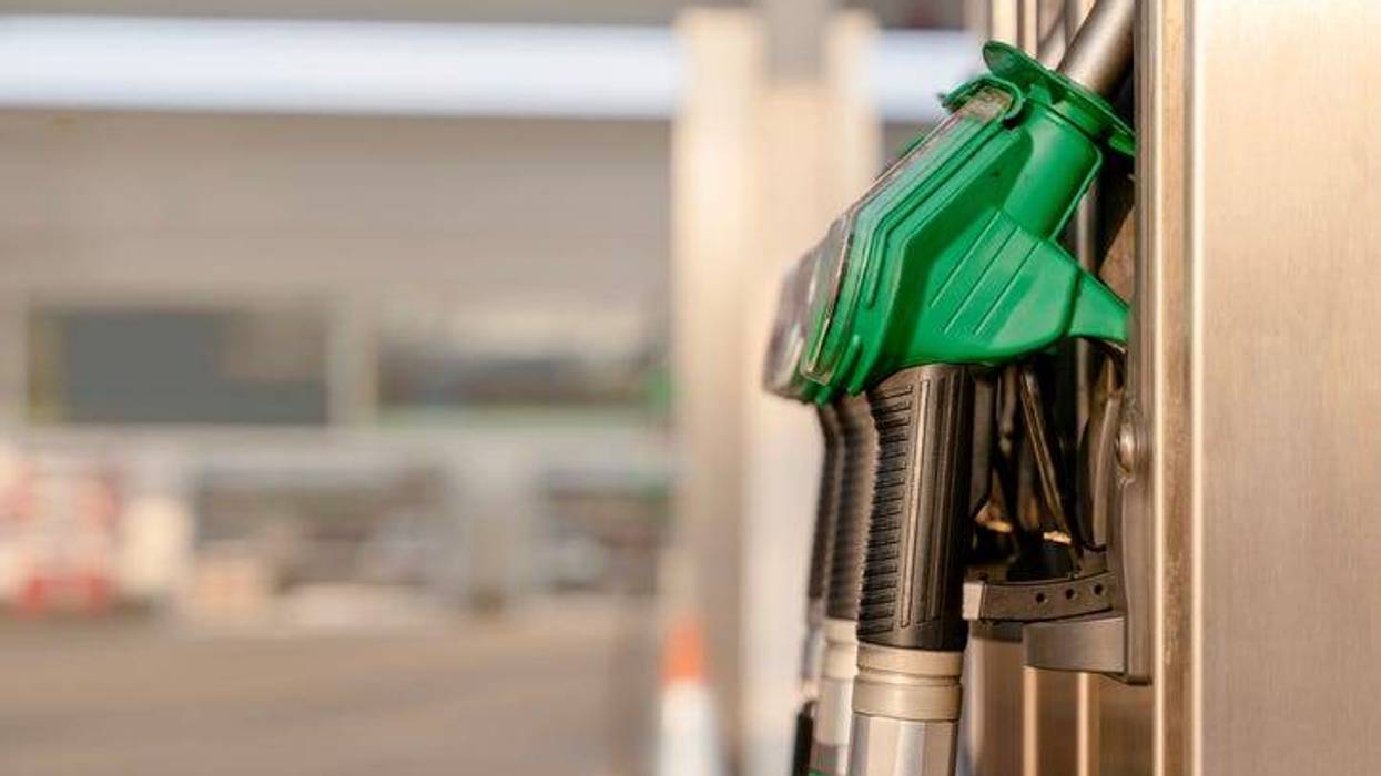 Close-up of filling nozzles for petrol and diesel at gasoline fuel station