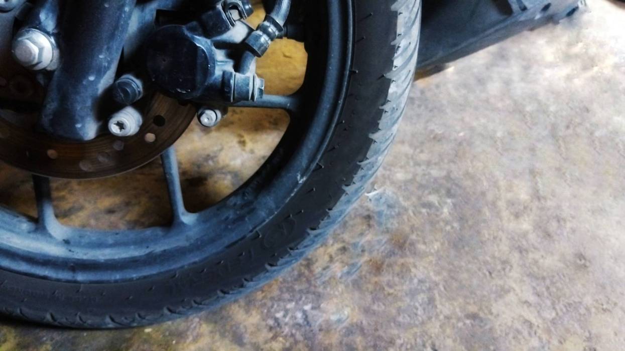 Close-Up of Motorcycle Front Tire with Disc Brake