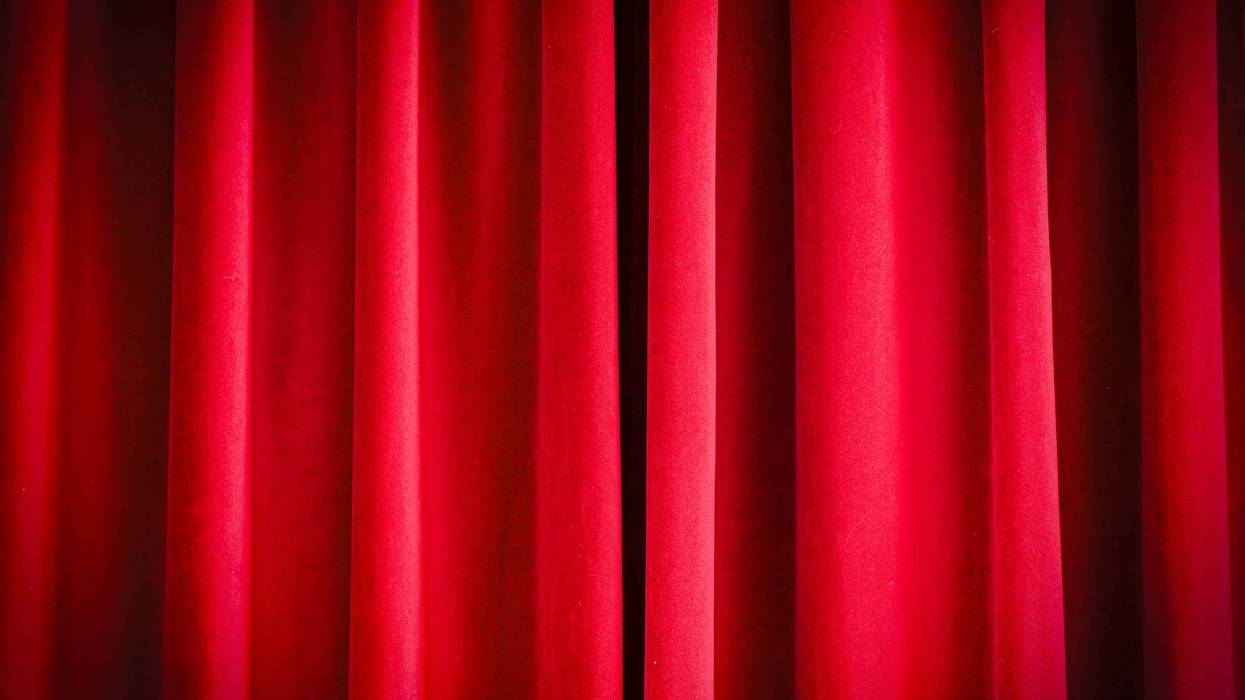Close-up of red closed curtains as background
