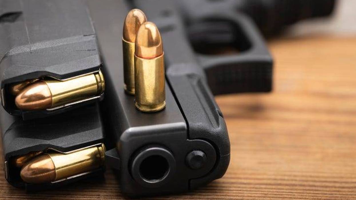 Close up of the muzzle of a gun with multiple bullets loaded