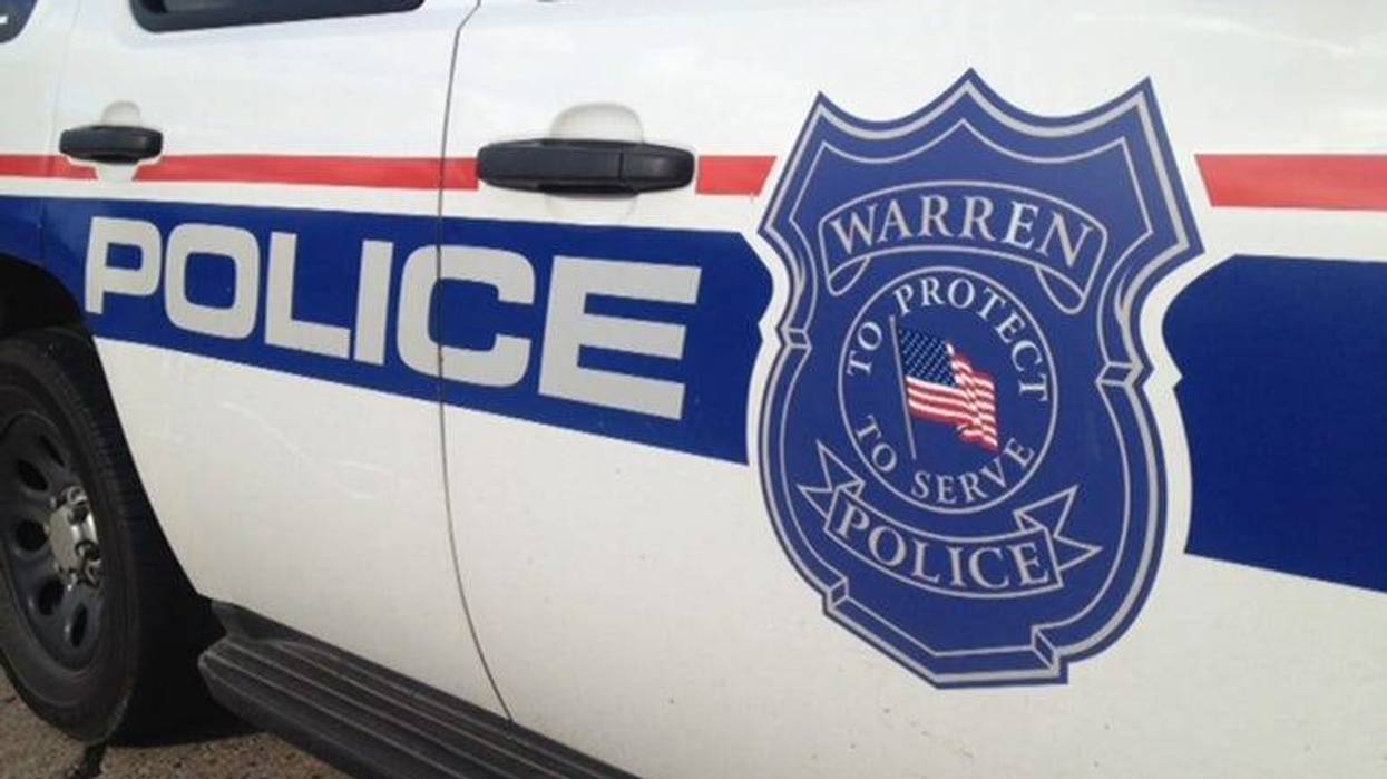 Close up of Warren Police vehicle with badge logo.